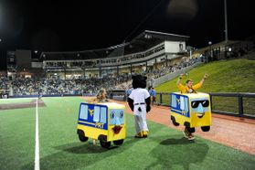 People wearing PRT costumes race at Mon County Ballpark
