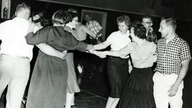 Students square dancing