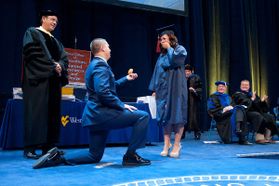 Kneeling graduate proposes to girlfriend