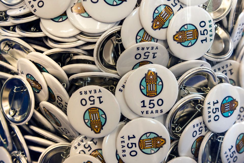 Pile of WVU 150th birthday celebration buttons