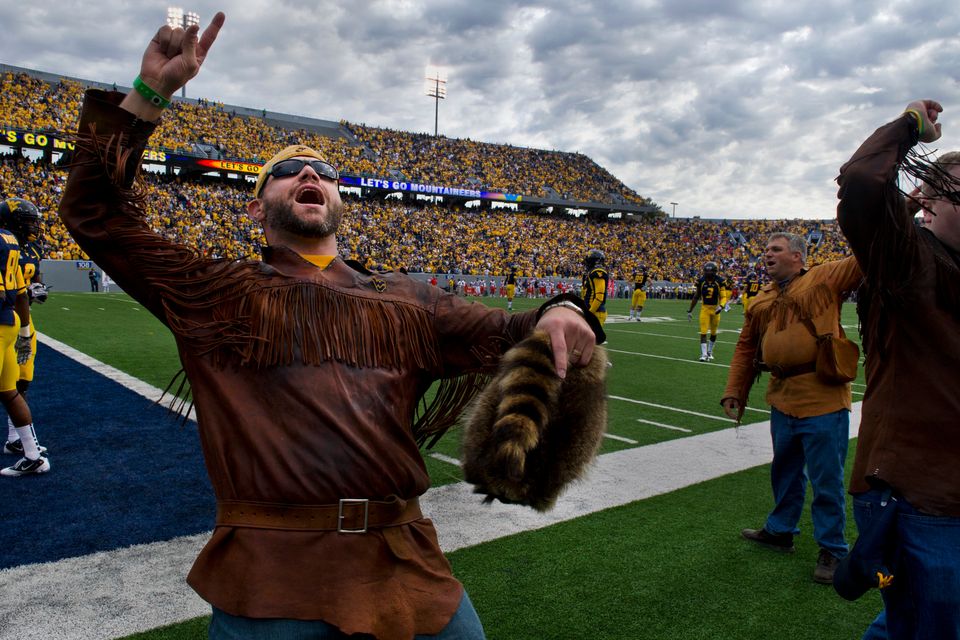A former Mountaineer Mascot cheering on the WVU football team at a recent game