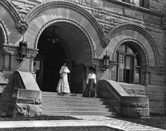 Two students on steps of Stewart Hall
